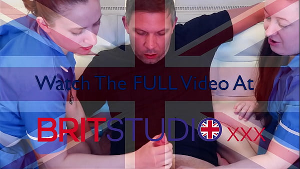 Two gloved nurses wank off a patient