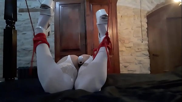 Laura on hee step sister bound on a bed in white catsuit vibed and deepthroat a large cock