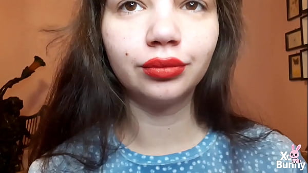 Natural lips with red lipstick smoking a cigarette in close up 