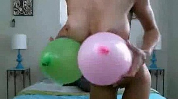 Cam slut plays with balloons 