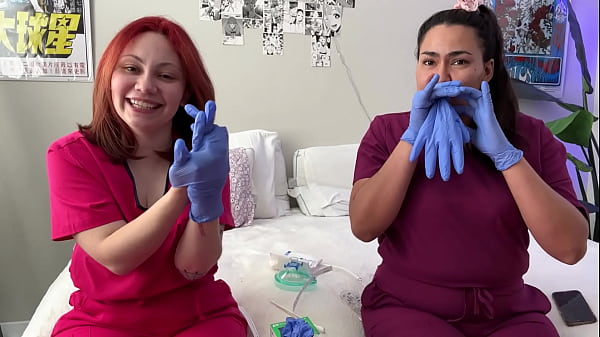 Hot nurses in scrubs mess around with gloves 