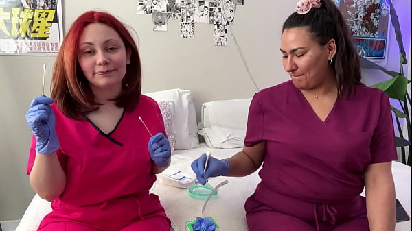 Hot nurses in scrubs mess around with gloves 