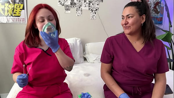 Hot nurses in scrubs mess around with gloves 