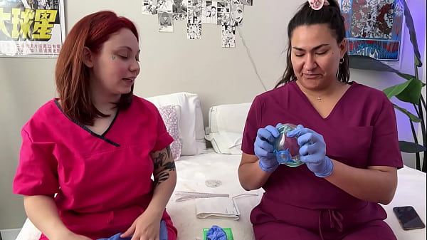 Hot nurses in scrubs mess around with gloves 