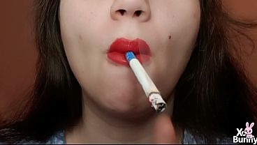 Tongue Piercing Girl Smoking A Cigarette With Red Lipstick On thumbnail