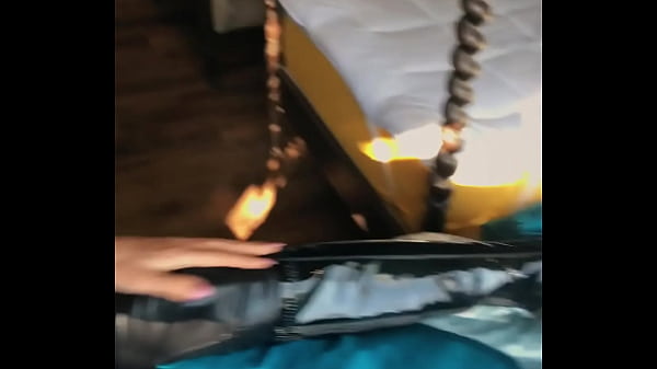 Woman in fetish gear showing off in window 