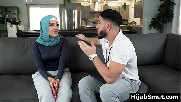 Young muslim girl_trained by her soccer_coach