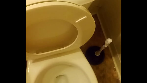 21 year old taking a piss in the toilet with a bit of penis showing