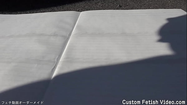 Print the traces of a girl's bicycle tire on a notebook 