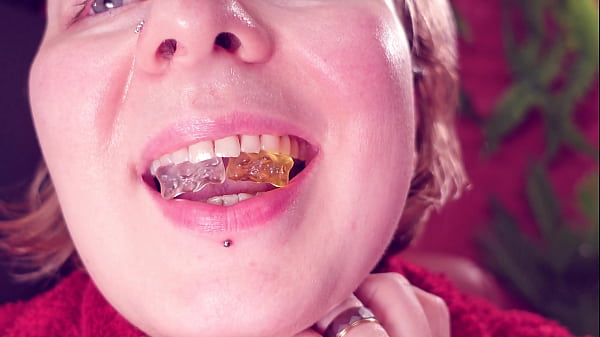 Eating jelly teddybears candies chewing mouth close up 