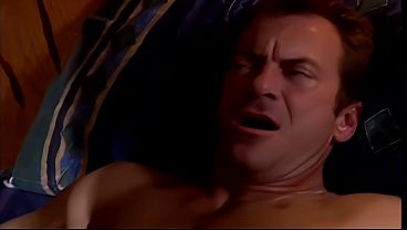 Her tits get massaged while she gives one guy a blowjob and gets her shaved twat screwed 