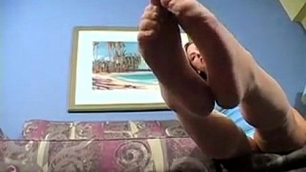 Blonde chick teasing her feet close up 