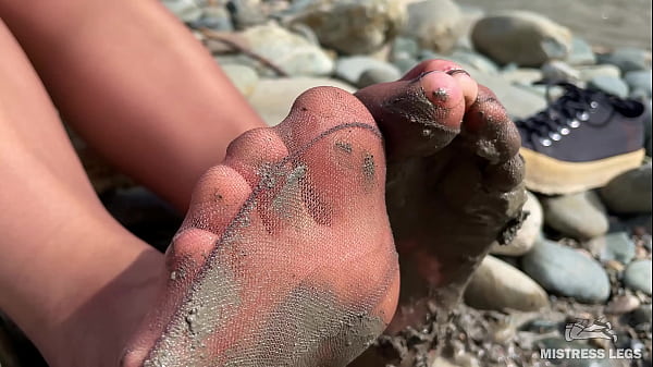 Dirty feet in pantyhose teasing outdoor