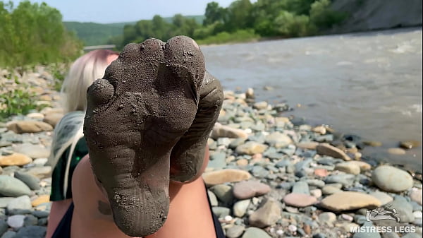 Goddess shows you_her messy nylon_feet close ups in torn pantyhose_on the_river bank