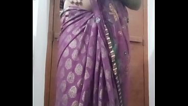 Indian Gay Crossdresser Bottom Gaurisissy pressing and playing with her big boobs in purple saree with heavy jwellery 