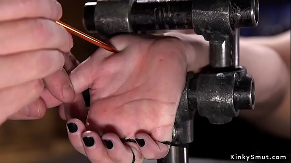 Brunette in spread eagle bondage caned