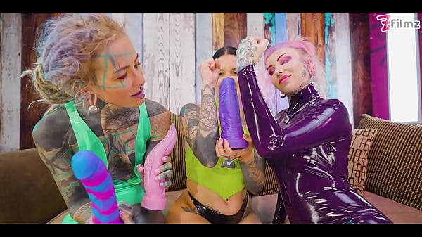 Two dominas gang up on Goth chick to fill her holes with toys and make her cum 