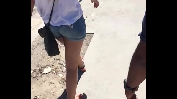 Sexy girl in booty shorts walking voyeur 