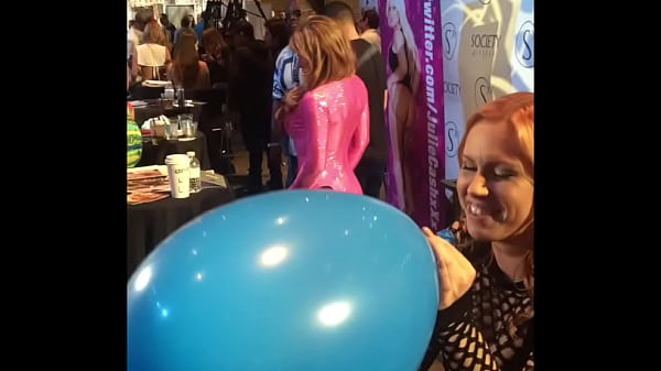 Edyn Blair blows_up a giant balloon