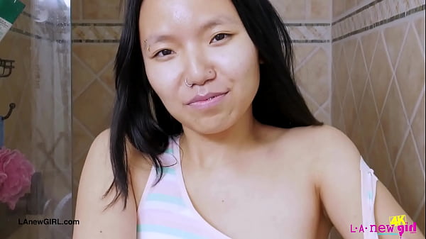 Graceful Asian beauty took ashower