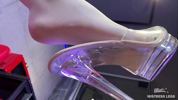 I sit on the couch in sexy white stockings and dangle my heels