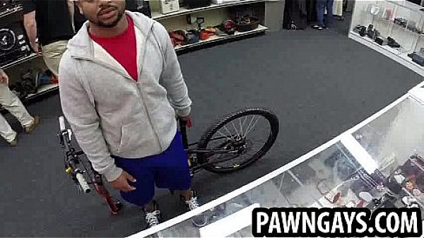 Ebony hunk tries to sell a bike at the pawn shop 