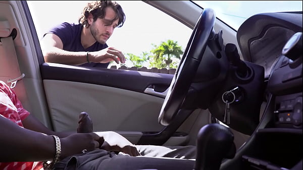 A Black Cock Gets Jerked Off In The Car While Another Dude Watches Him thumbnail