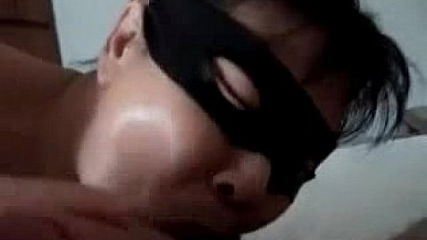 Asian wife wearing a mask and sucks cock 