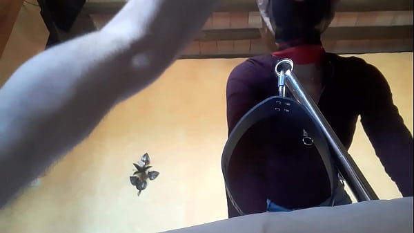 Tied to a machine, masked and hooded, she_has to suck a_big cock