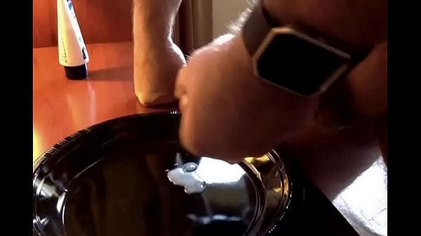 Slurping semen off a plate. 