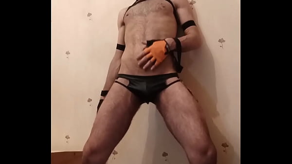 A guy in jocks and a dog mask puts his body on display and appeases himself 