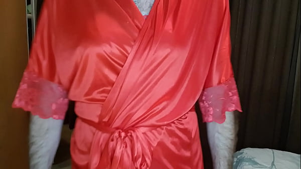 Man parading around in red lingerie. 