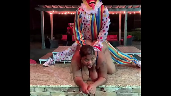 Clown fucks BBW at night on the patio 