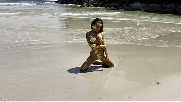Hot Monika Fox In Gold On Public Beach thumbnail