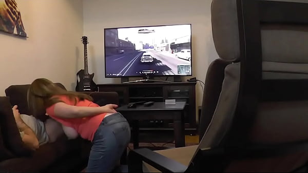 Boyfriend gets his dick sucked playing xbox busty gamer girlfriend giving topless blowjob with her big natural boobs bouncing and swinging