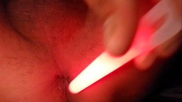 Playing with penlight in anal