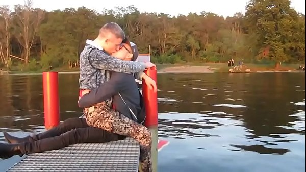 two hot gays kisses each other  with passion outdoor