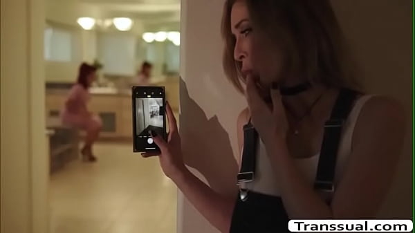 Shemale stepmom caught her stepdaughter recording while shes changing clothes.She confronts her and her stepdaughter tells her that she just wants to see her boobs.After that,she lets her stepdaughter suck her shecock and she then fucks her pussy. 