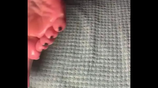 Milf showing off oiled feet