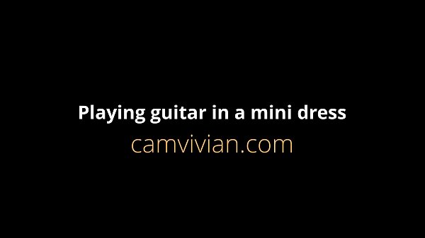 Play MP4 - Playing guitar in a mini dress