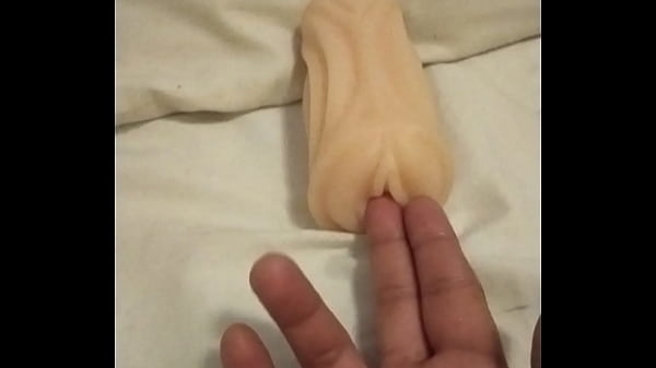 Playing with artificial pussy