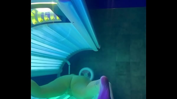 Ally White masturbates in_tanning_booth