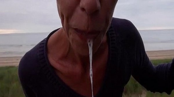 Cock blowing at the beach 