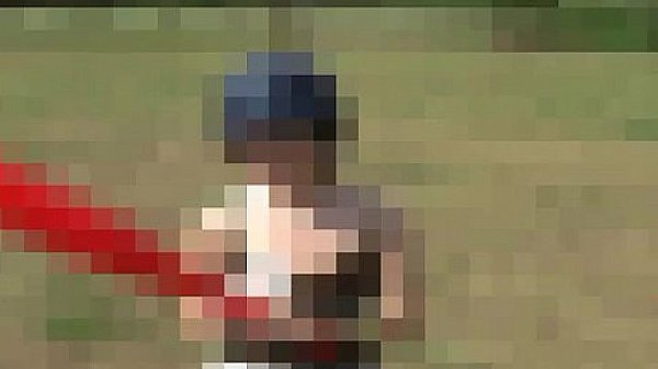 Kitty blowing bubbles in her miniskirt 