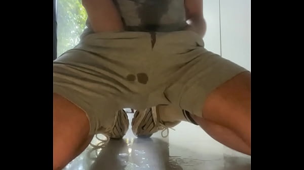 Amateur boy wets himself on the kitchen floor 