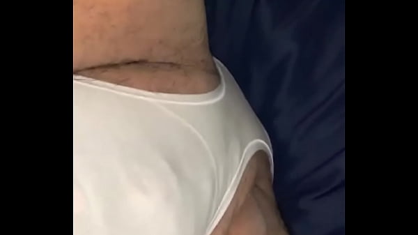 Guy modeling white panties In bed 