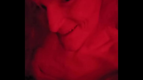 Pink hair egirl teasing in red light slapping breasts and face 