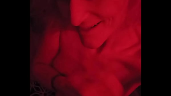 Pink hair egirl teasing in red light, slapping breasts and face