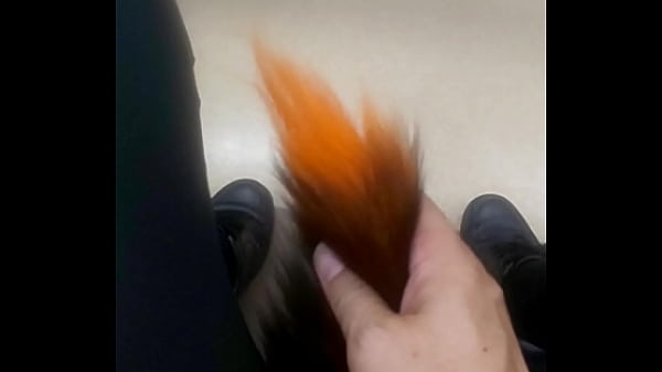 I'_m sticking an anal plug made of a fox tail.