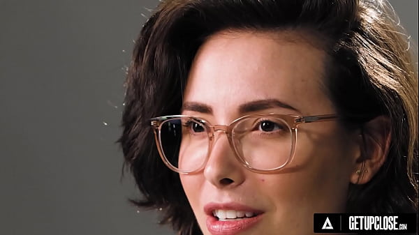 Nerdy brunette with glasses masturbates